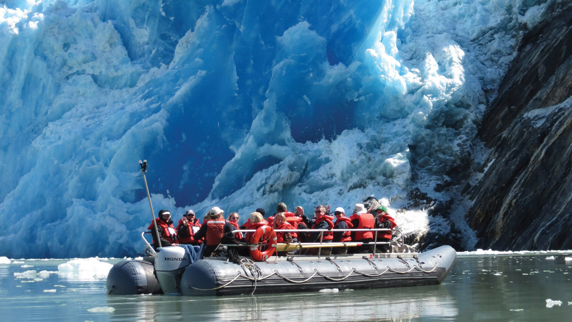 Small boats take passengers close to the face of glaciers.