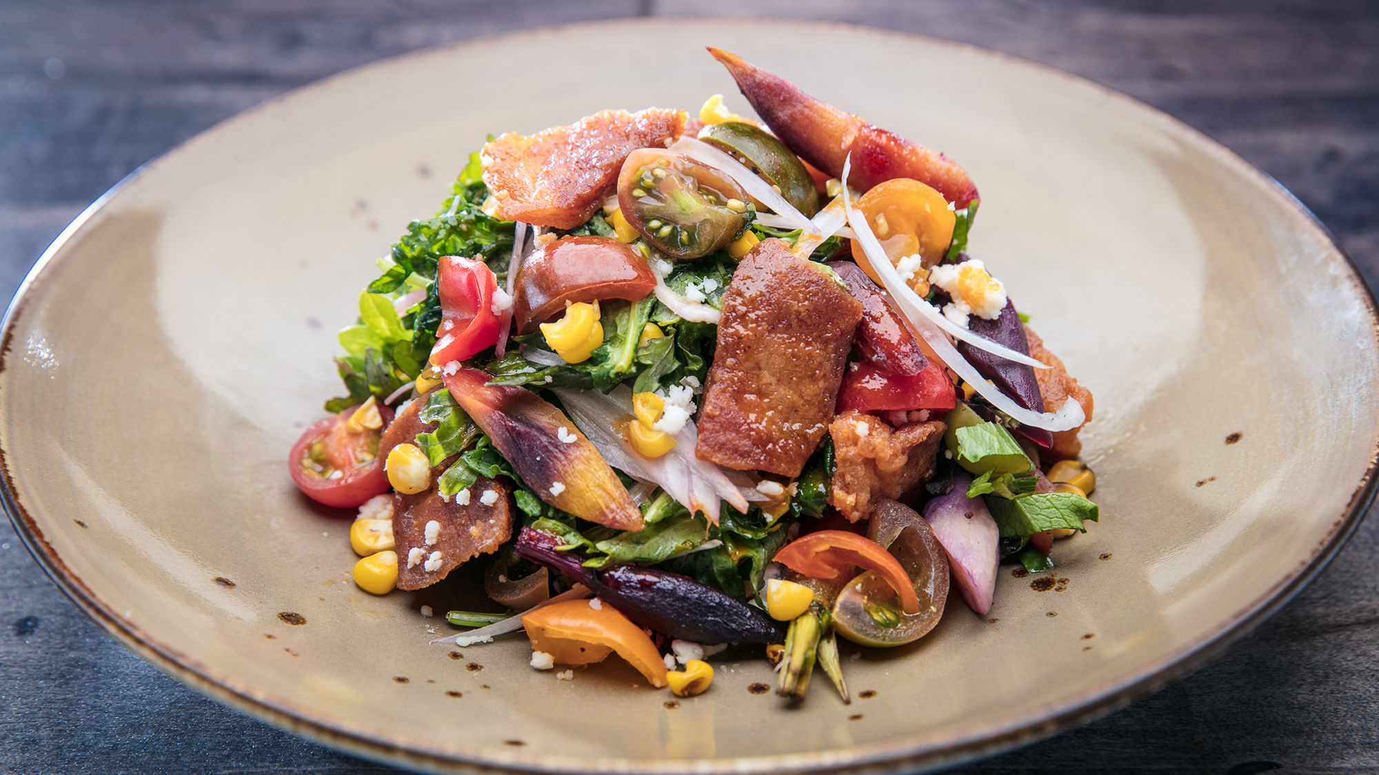 Bandito serves fresh Latin fare in a colorful setting, like the chicharron and arugula salad.