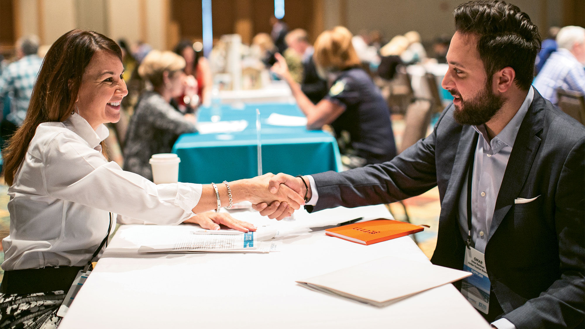 Travel adviser Ginny Mariano of Avanti and the Jordan Tourism Board’s Omar Banihani shake hands after a successful meeting.