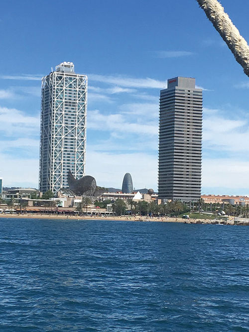 Frank Gehry’s fish sculpture, “Peix,” sits in front of the Mapfre Tower on Barcelona’s waterfront; the tower on the right is the Hotel Arts. Frank Gehry’s fish sculpture, “Peix,” sits in front of the Mapfre Tower on Barcelona’s waterfront; the tower on the right is the Hotel Arts.