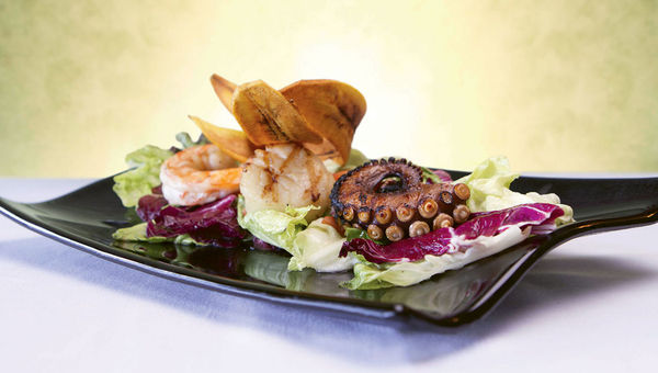 The property’s El Faro restaurant offers globally inspired cuisine with themed menus nightly. The property’s El Faro restaurant offers globally inspired cuisine with themed menus nightly.