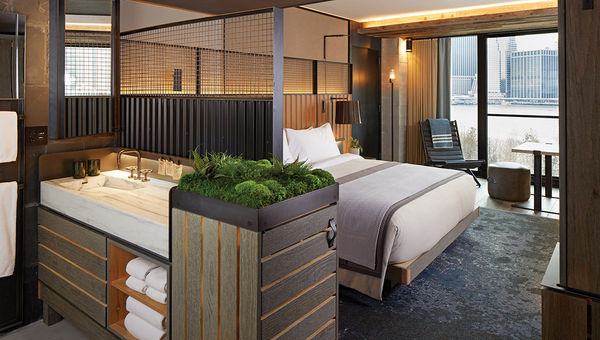 A 1 Hotel Brooklyn Bridge guestroom’s sleeping area.