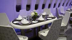 Senior editor Jamie Biesiada had a chance to explore the luxury jet at McCarran Airport in Las Vegas during Virtuoso Travel Week when Crystal's president and CEO Edie Rodriguez invited the media onboard for a look. The lounge area features four oval tables with six swiveling seats each. The tables can be used for gaming or set for dining, and their seats are equipped with seat belts.