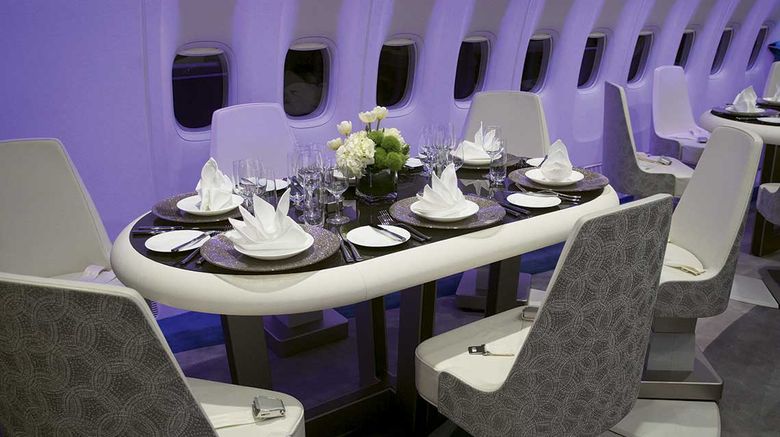 Senior editor Jamie Biesiada had a chance to explore the luxury jet at McCarran Airport in Las Vegas during Virtuoso Travel Week when Crystal's president and CEO Edie Rodriguez invited the media onboard for a look. The lounge area features four oval tables with six swiveling seats each. The tables can be used for gaming or set for dining, and their seats are equipped with seat belts.