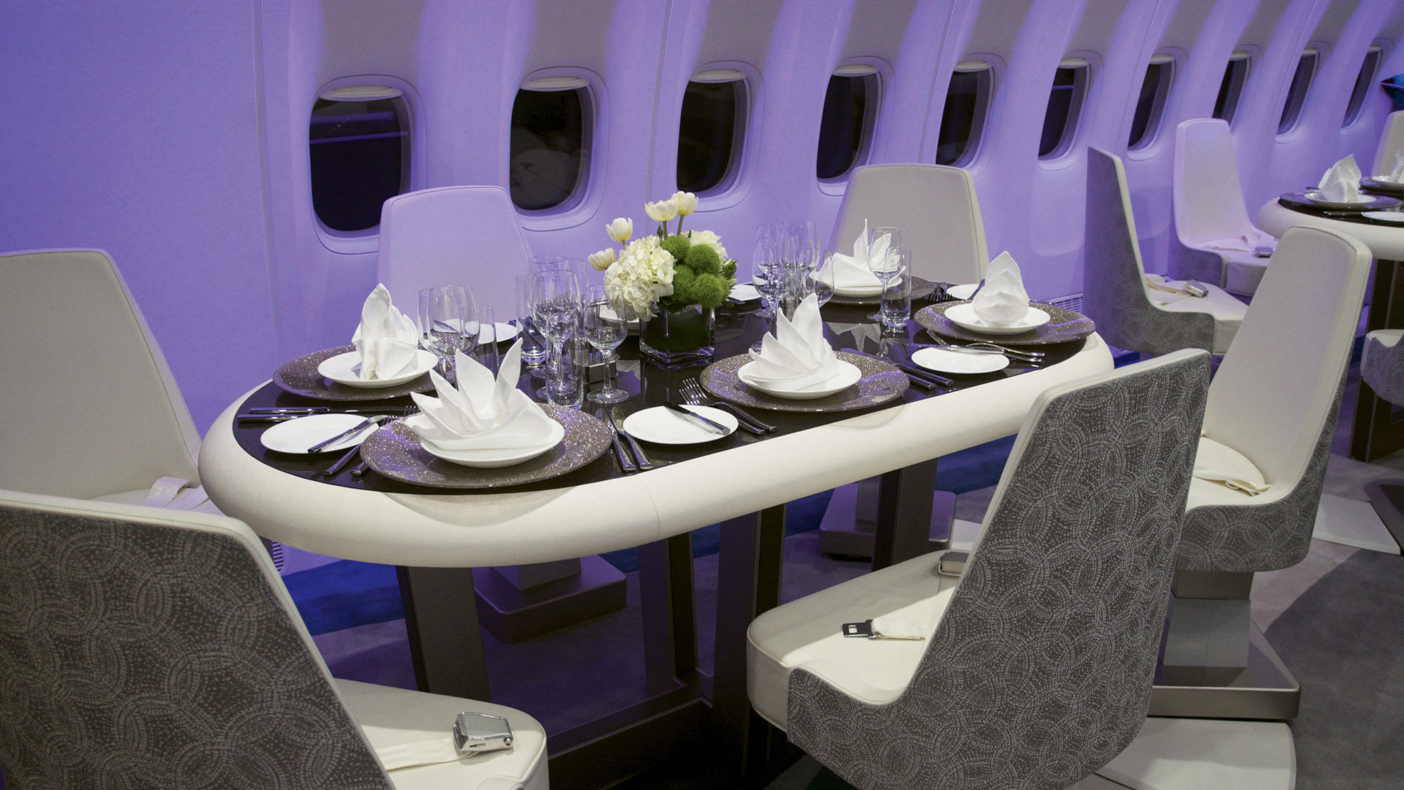 The lounge aboard the Crystal Skye features four oval tables with six swiveling seats each.
