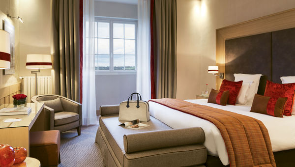 A guestroom at L’Hotel du Golf, where decor offers nods to golf’s Scottish antecedents and Deauville’s equestrian heritage. A guestroom at L’Hotel du Golf, where decor offers nods to golf’s Scottish antecedents and Deauville’s equestrian heritage.