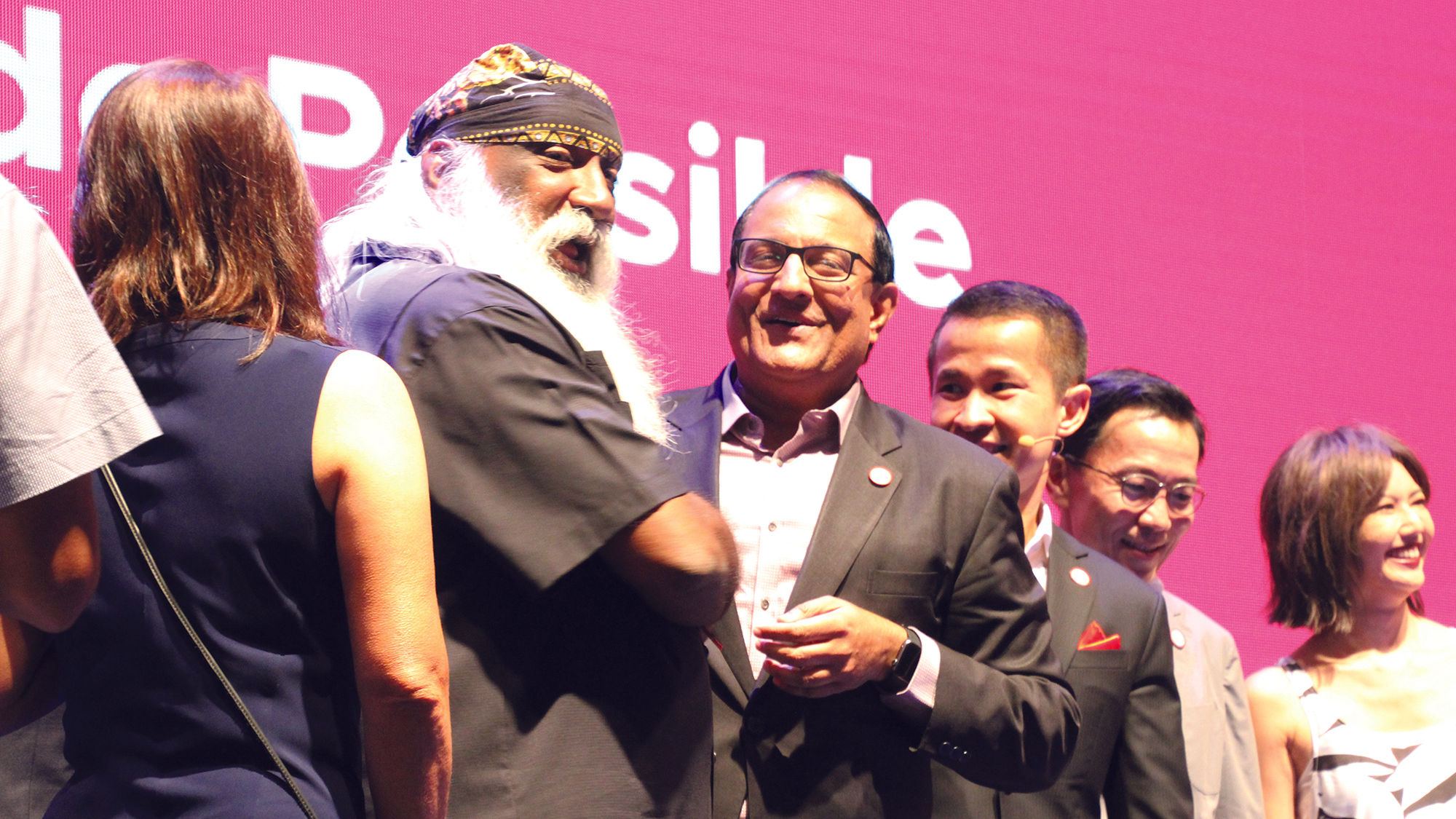 S. Israwan, Singapore's minister of trade and industry (center), shakes hands with naturalist Subaraj Rajathurai during the STB's event celebrating the launch of its "Passion Made Possible" campaign.