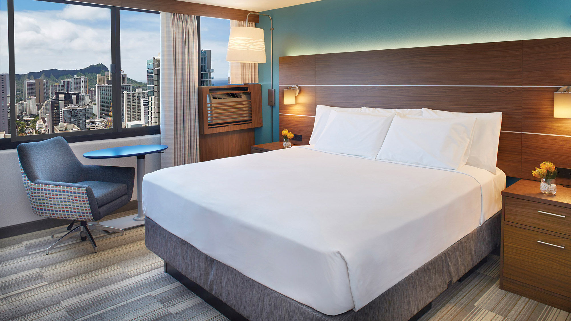A partial oceanview king guestroom at the Holiday Inn Express Waikiki.