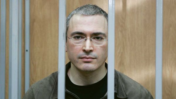 Mikhail Khodorkovsky, former owner of oil giant Yukos, stands behind bars of the defendant's cage during his trial for fraud and tax evasion in Moscow in April 2005. Mikhail Khodorkovsky, former owner of oil giant Yukos, stands behind bars of the defendant's cage during his trial for fraud and tax evasion in Moscow in April 2005.