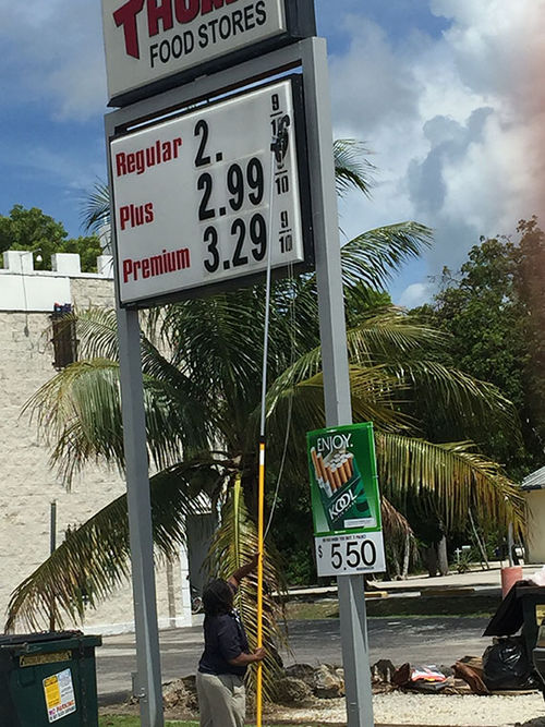 A worker takes the prices down at a Tom Thumb gas station in Key Largo on Wednesday because the pumps were empty. A worker takes the prices down at a Tom Thumb gas station in Key Largo on Wednesday because the pumps were empty.