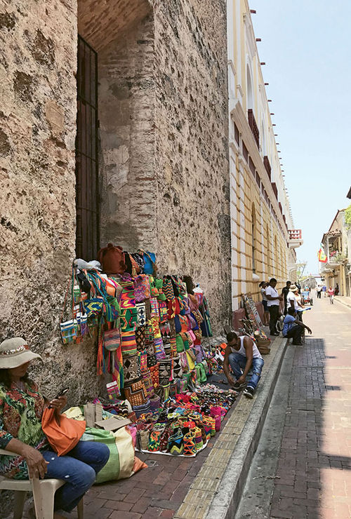 Vendors in Cartagena’s Old City, which was built by the Spanish in the early 1500s to protect the port from pirates and other hostilities. Vendors in Cartagena’s Old City, which was built by the Spanish in the early 1500s to protect the port from pirates and other hostilities.