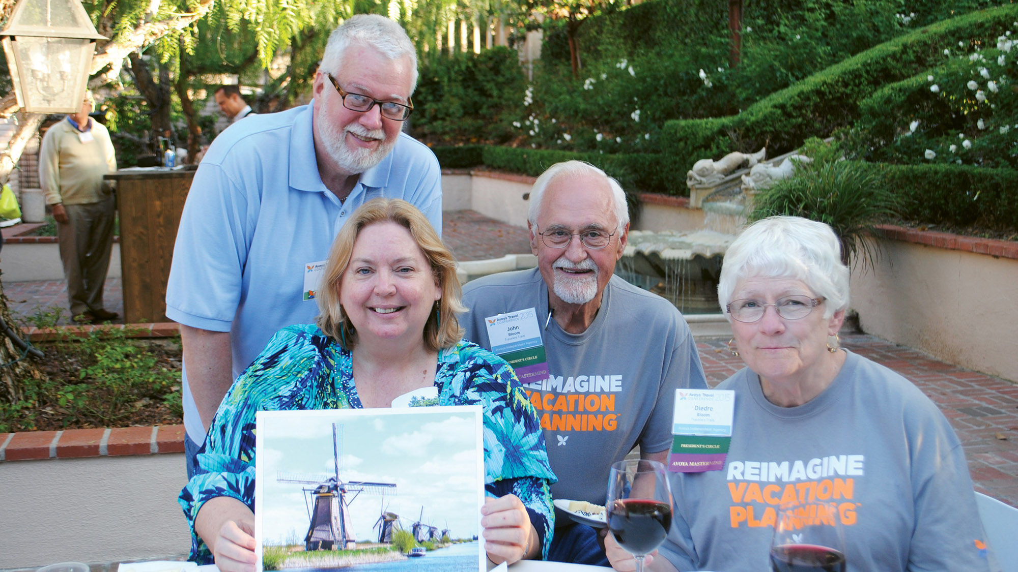 Skip Fortier, standing, Avoya Travel’s associate vice president of JoinAvoya, with his friends Carol Howell and John and Diedre Bloom during Avoya’s 2015 conference.