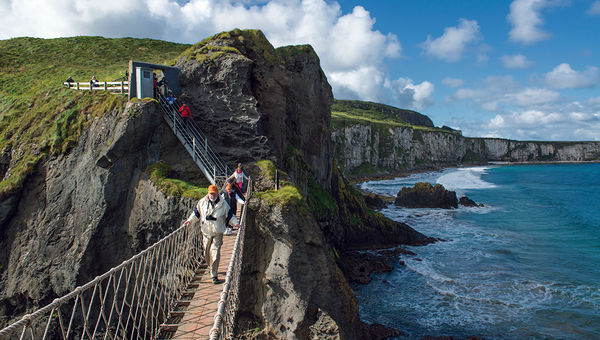 The popular Carrick-a-Rede rope bridge in County Antrim connects the mainland to a small island once used by fishermen. The popular Carrick-a-Rede rope bridge in County Antrim connects the mainland to a small island once used by fishermen.