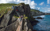The popular Carrick-a-Rede rope bridge in County Antrim connects the mainland to a small island once used by fishermen.