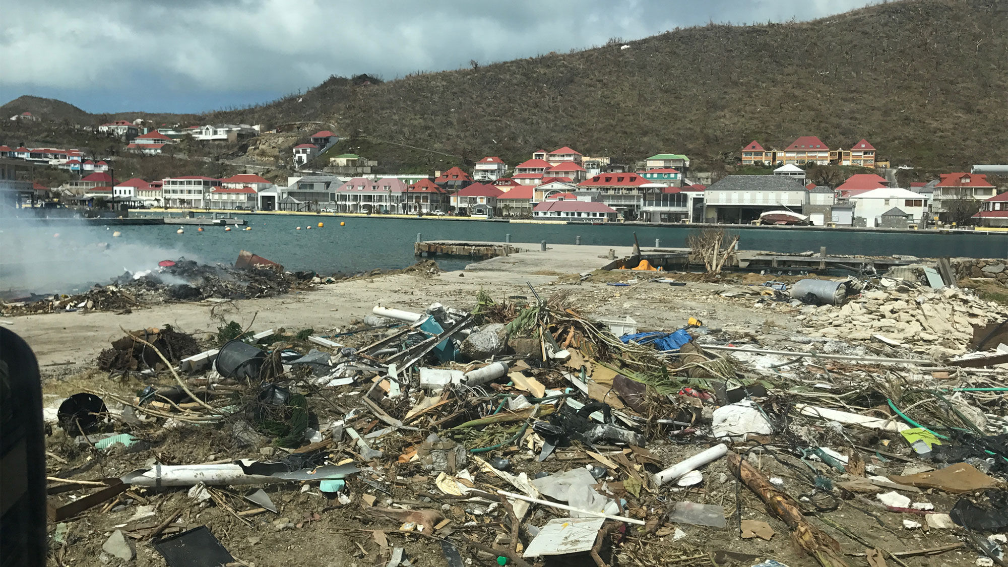 Twisted wreckage and a denuded landscape on St. Barts.
