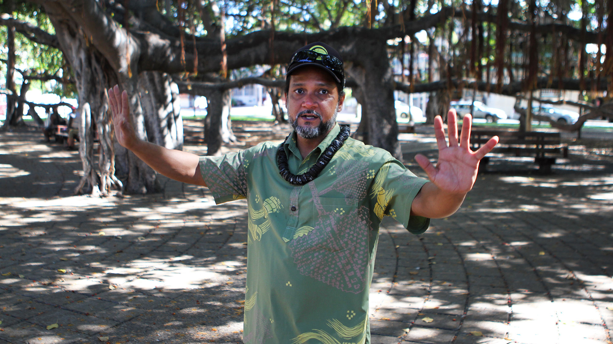 Kalapana Kollars, tour guide for the Maui Nei historic and cultural Lahaina tour, discusses the history of the town's banyan tree, said to be the largest in the U.S.