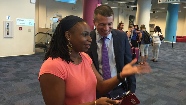 Hurricane Irma evacuee Arlene Graham shares a photo of the storm with Norwegian Cruise Line CEO Andy Stuart at PortMiami. Hurricane Irma evacuee Arlene Graham shares a photo of the storm with Norwegian Cruise Line CEO Andy Stuart at PortMiami.