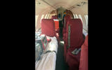 Upon entering the plane, the cockpit is to the left. To the right are passenger seats (this jet was equipped with six) and a stretcher.