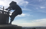 A statue of a man crushing grapes overlooks the Napa Valley, which was relatively clear and smoke-free on Monday, Oct. 16.