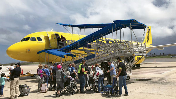 Passengers board one of Spirit's relief flights in Aguadilla, Puerto Rico, on Sept. 29. Passengers board one of Spirit's relief flights in Aguadilla, Puerto Rico, on Sept. 29.