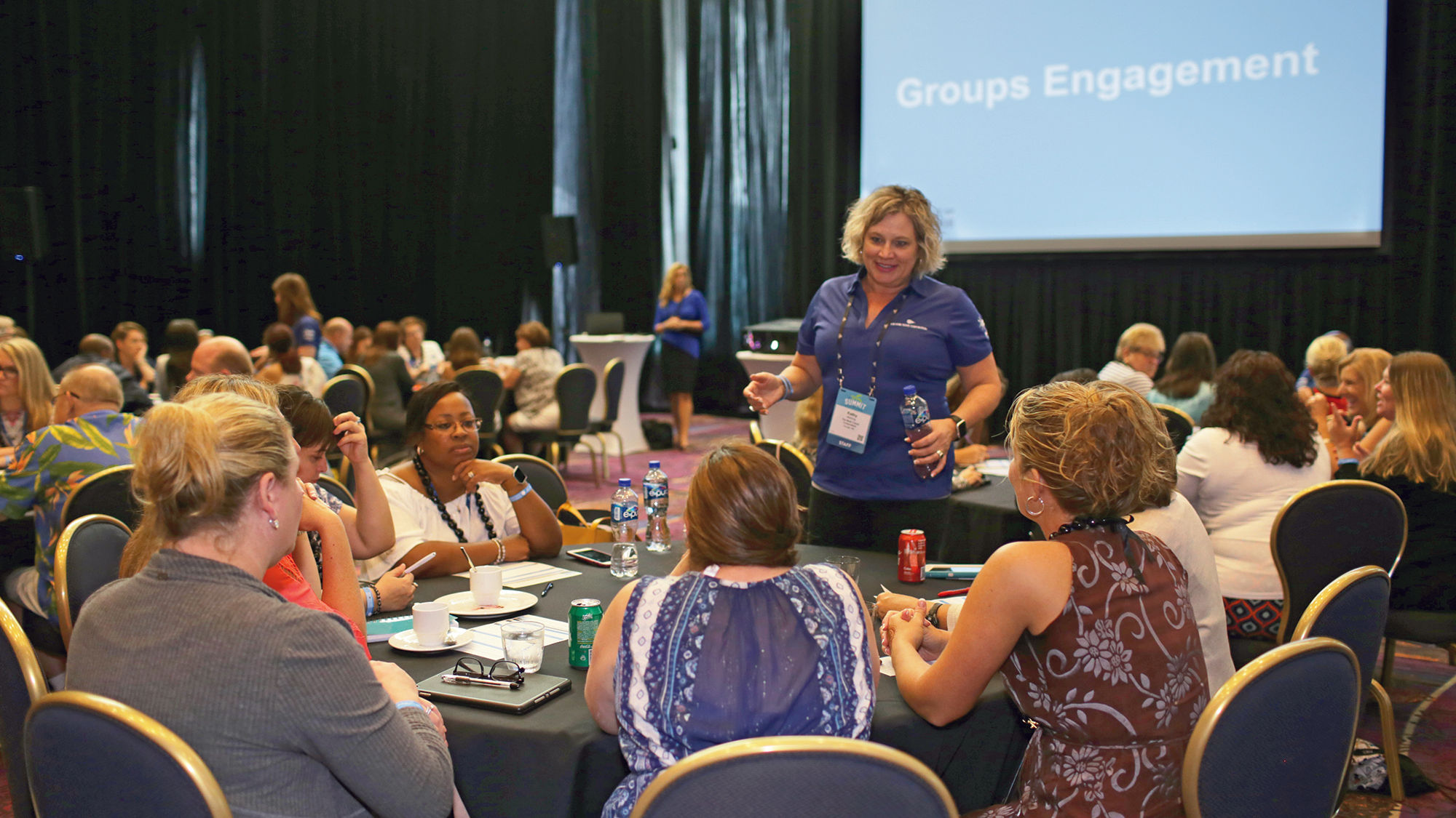 Agents at the Mark Travel Summit participate in a “think tank” forum about how to improve the group booking experience with the company.