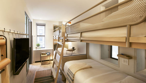 A quad room with twin bunk beds. Amenities include foldaway furniture, rainfall showers and pegboard closets. A quad room with twin bunk beds. Amenities include foldaway furniture, rainfall showers and pegboard closets.