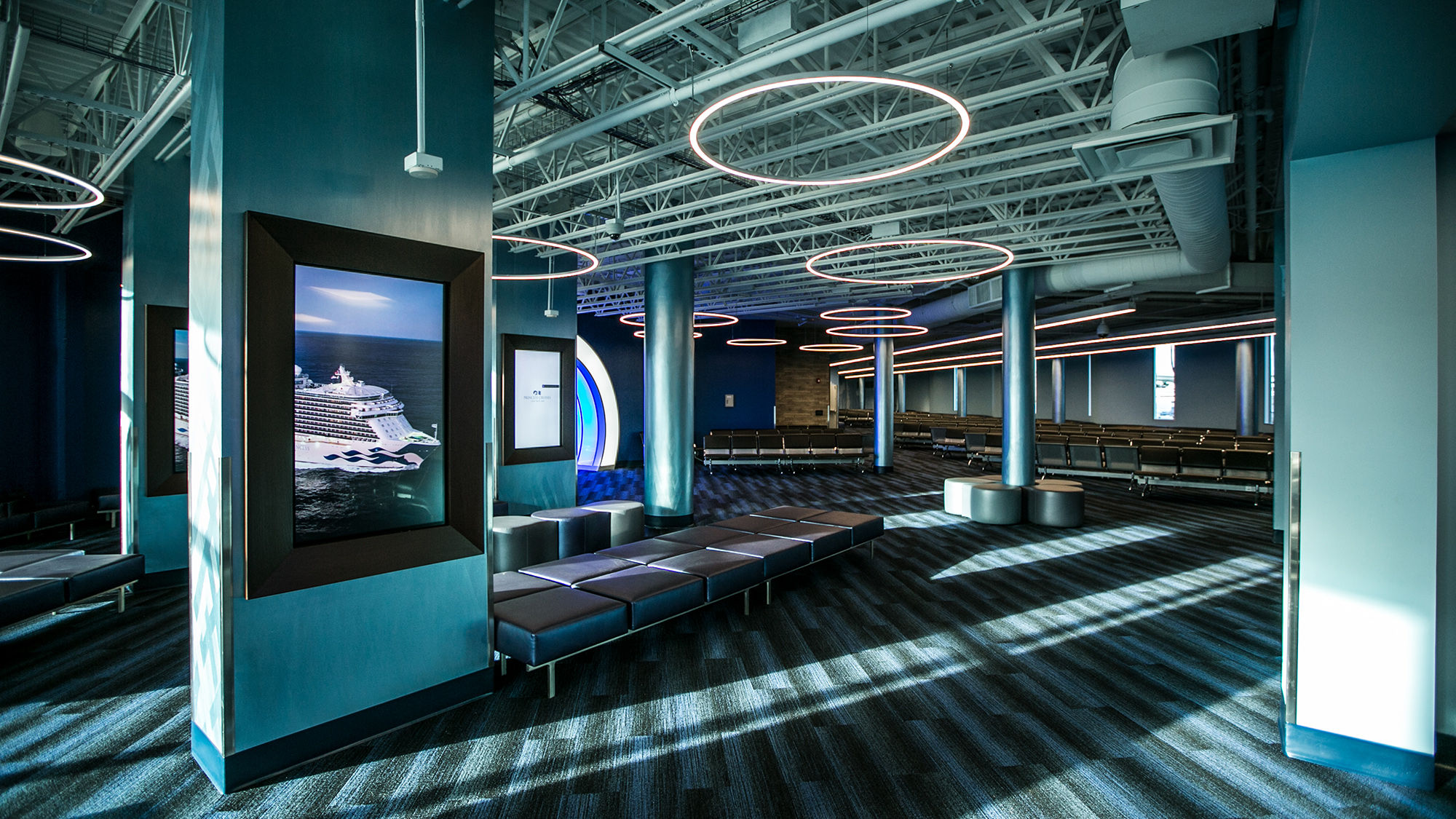 Large electronic display panels can be used to interact with the Ocean Medallion and its app to make reservations and play games.