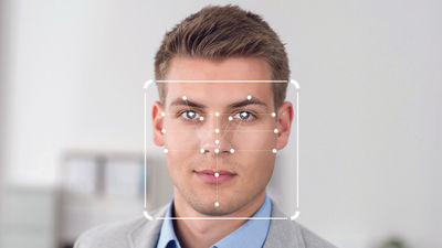 Flyers establish a secure identity by scanning their digital passport with a mobile phone, which is then verified against a facial photo.