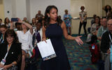 Denella Ri'chard presents a workshop on behalf of Holland America Line to a packed room.
