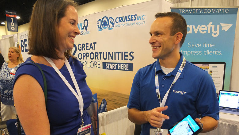 Travefy's Scott Rutz explains his product to Rebecca Vogt, an agent with the Cruise Captain in Tampa.