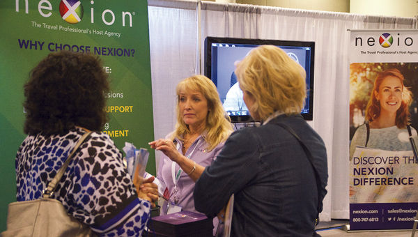 Nexion representative Wendy Graziano meeting with agents during Travel Weekly’s CruiseWorld in 2016.