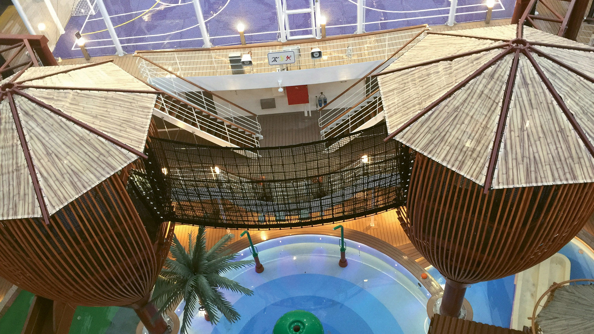 The waterpark on the MSC Seaside includes two towers connected by a suspension bridge.
