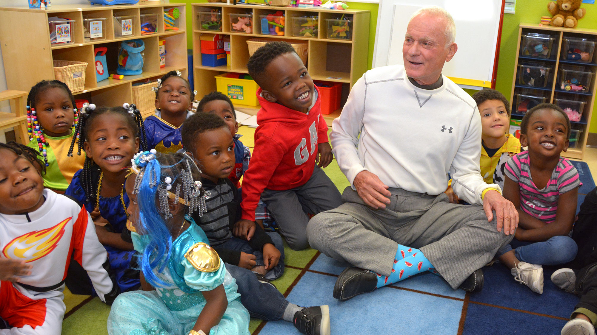Harris Rosen with schoolchildren from the Orlando neighborhood of Parramore. The hotelier pays college tuition for Parramore students who graduate high school.