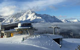 The snow-capped peaks of the Dolomites loom over Three Peaks ski resort near the town of San Candido.