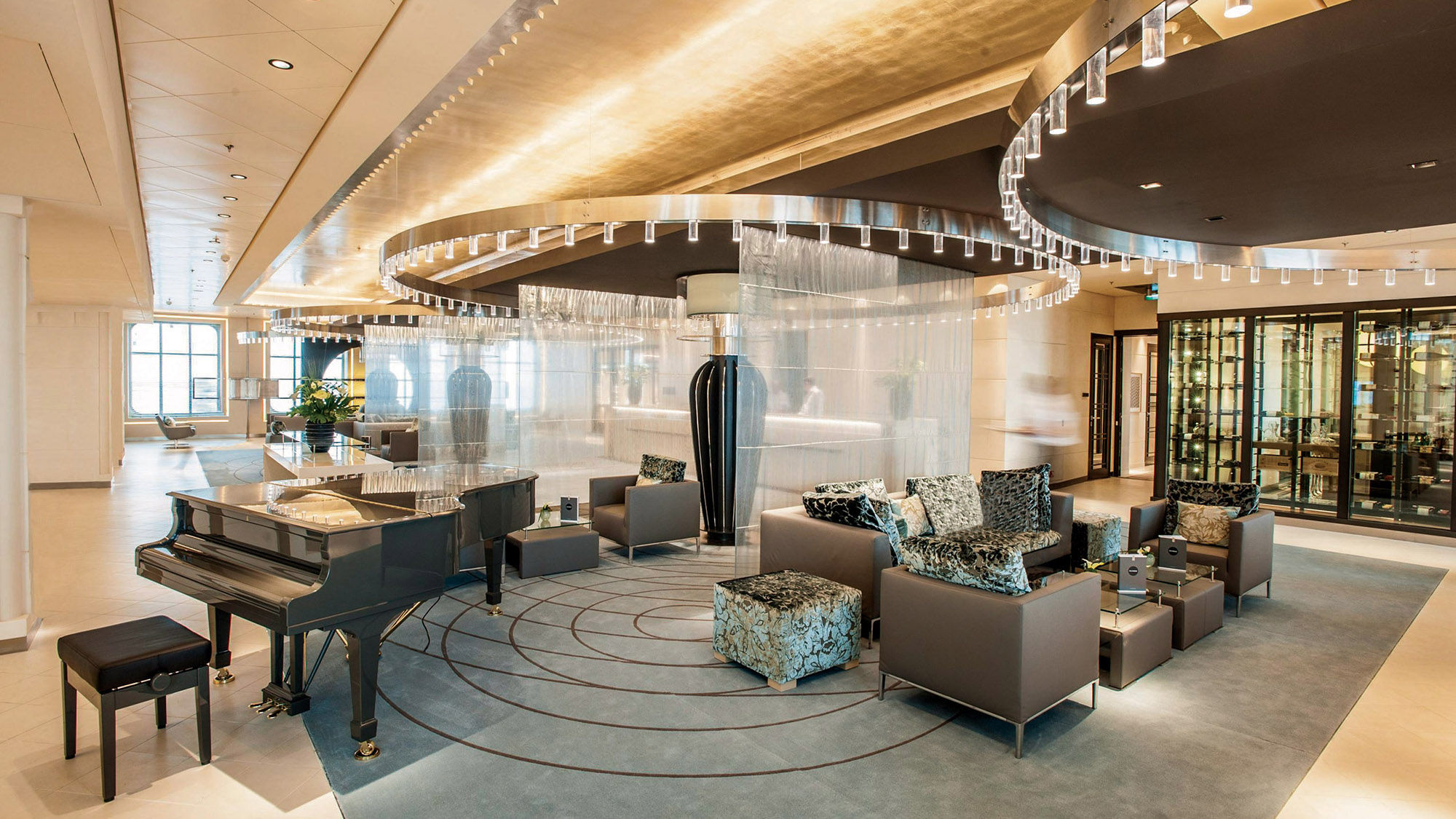 The atrium and piano bar where passengers embark the redesigned Europa 2 has a spacious feel.