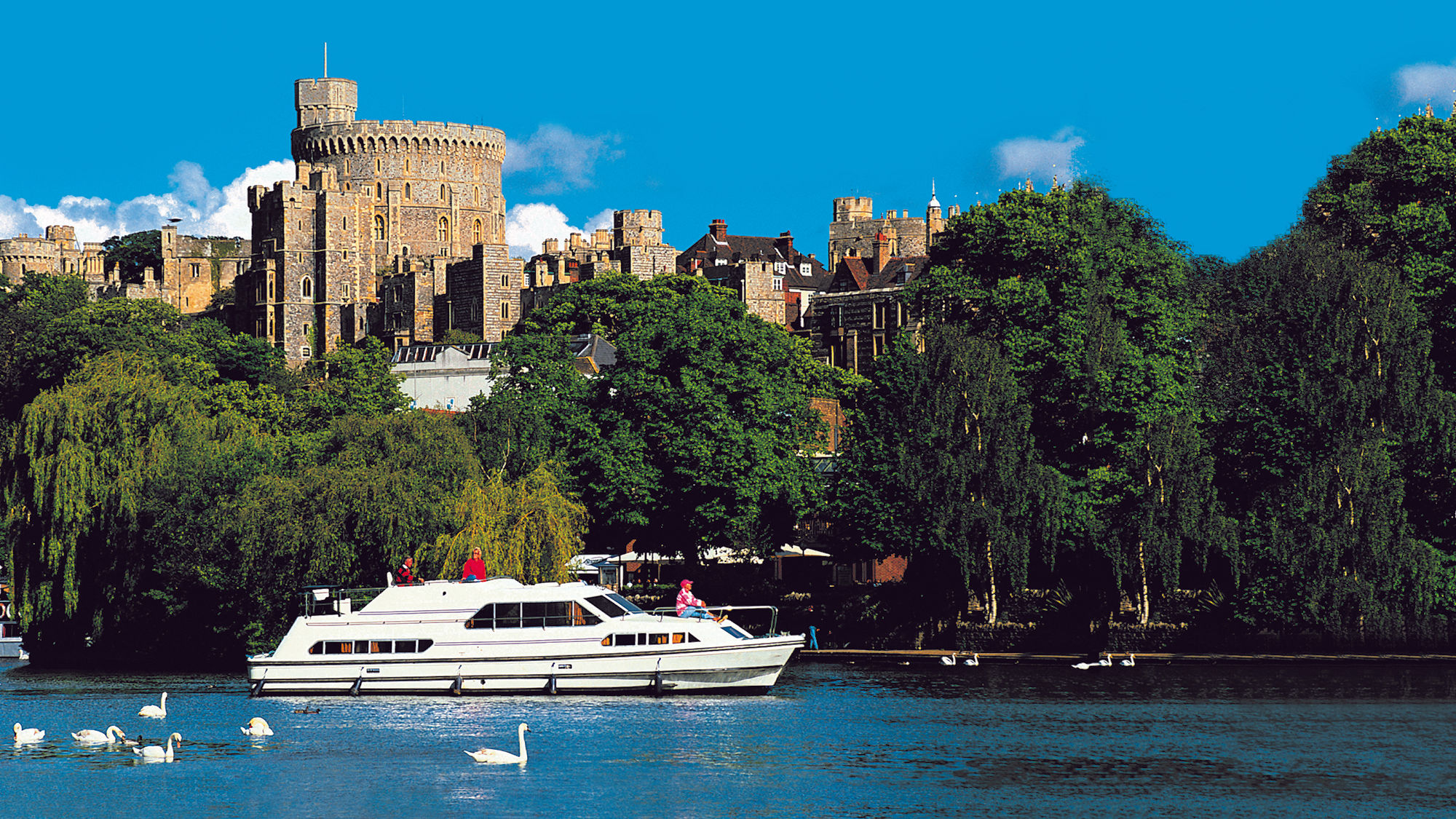 A self-drive Le Boat vessel docked outside of Windsor Castle.