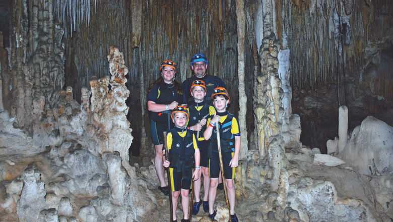 Certified Autism Travel Professional Nicole Thibault on a family vacation at Rio Secreto in Mexico with her husband, Chris, and sons Tristan, 13, Sebastian, 11 and Emerson, 9.