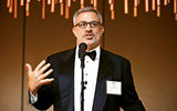 Tourism Cares CEO Mike Rea speaks during the Hearts of Travel Awards ceremony.