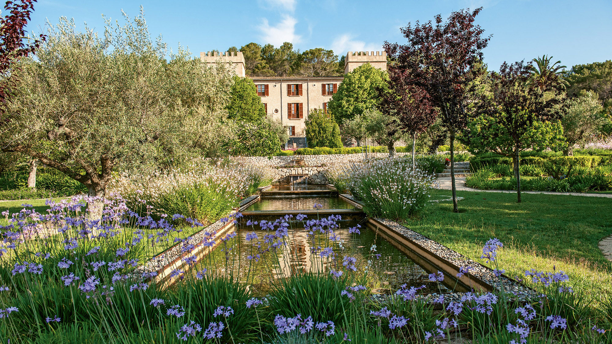 The fragrant grounds of the Castell Son Claret, a premier honeymoon destination set at the foot of the Tramuntana range on Mallorca.