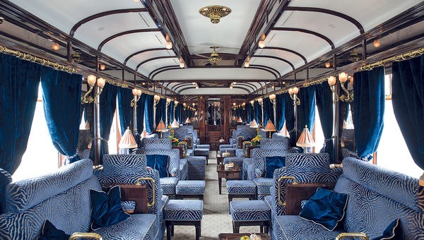 The lushly appointed bar car on the Venice Simplon-Orient-Express includes a piano. The lushly appointed bar car on the Venice Simplon-Orient-Express includes a piano.