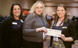 Signature Travel Network held its annual sales conference in December at the Mandalay Bay Resort in Las Vegas. At the event, Sue Collier of Destinations Unlimited, center, was presented with a check for $2,500 by Sarah Friesen of Tourism Victoria, right. They were joined by Signature's Rachael Signer. Collier was the consultant with the most bookings to Victoria, British Columbia, between May 1 and Dec. 1.