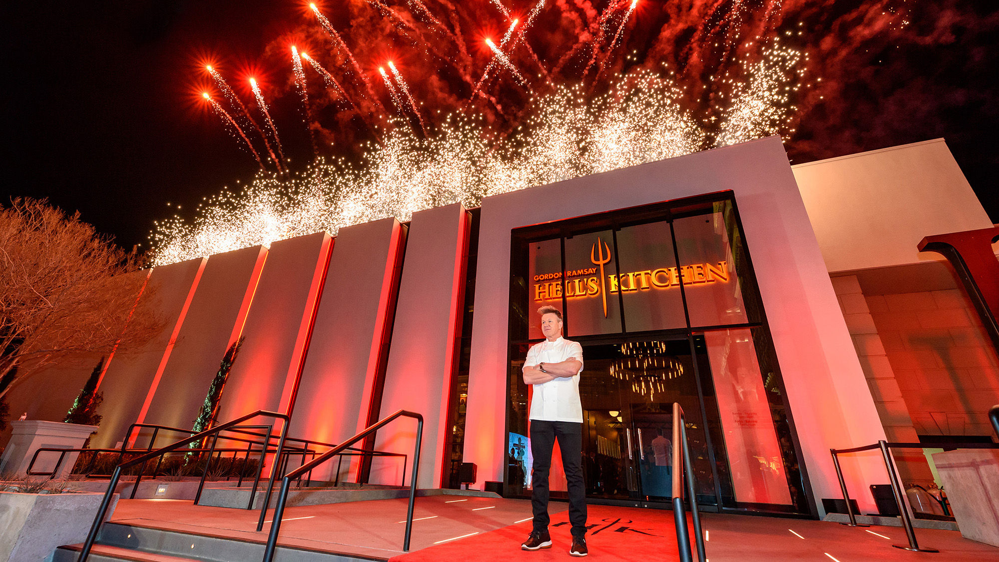 Chef Gordon Ramsay in front of his Hell' Kitchen restaurant.