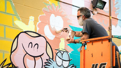 Pow! Wow! Hawaii invites an international roster of artists, such as Kevin Lyons seen here, to paint murals and participate in a variety of events in Honolulu for a week long festival every February.