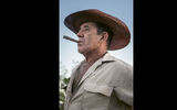 A farmer enjoys a cigar at the prize-winning organic farm and restaurant El Paraiso in the hills of Vinales.