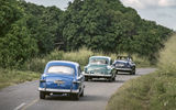 Classic cars make their way through western Cuba toward Vinales after turning off the Carretera Central, Cuba's main east-west highway.