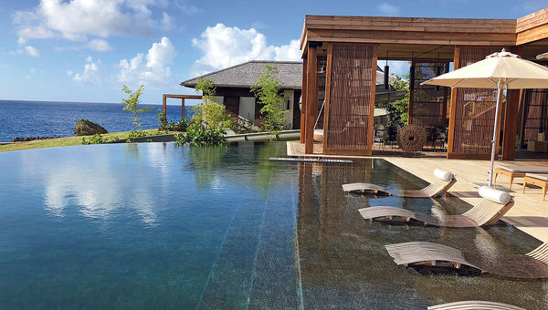 The infinity pool at the Ani Villas. The resort sits on a cliff and does not have its own beach, but the staff will take guests to a cove if desired. The infinity pool at the Ani Villas. The resort sits on a cliff and does not have its own beach, but the staff will take guests to a cove if desired.