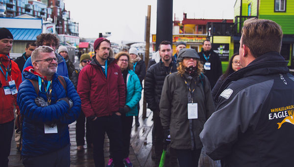 Delegates tour the revived Victoria Harbour in winter rain. Delegates tour the revived Victoria Harbour in winter rain.