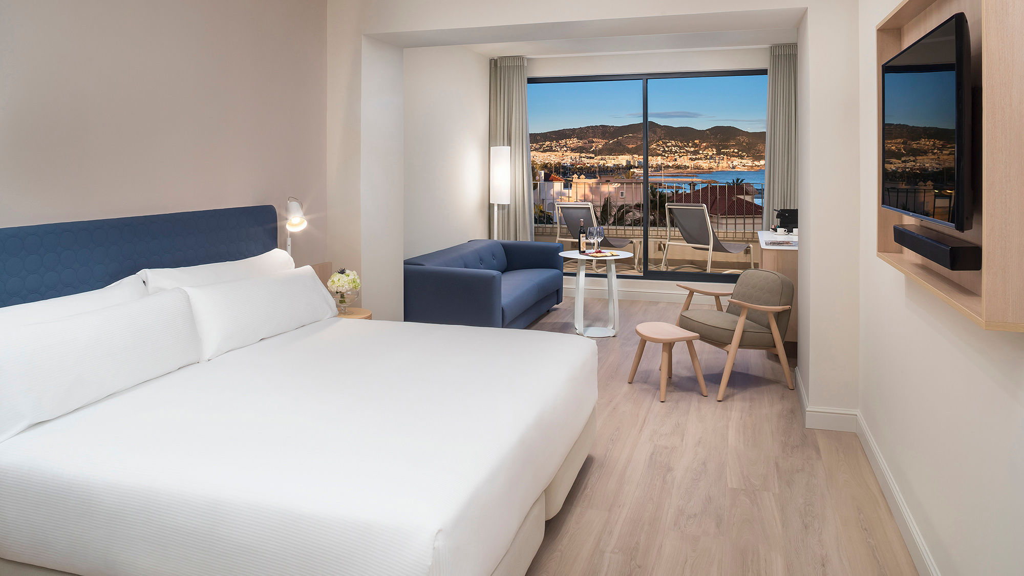 Guestrooms at the ME Sitges Terramar overlook the town of Sitges and the Mediterranean coast.