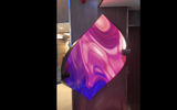 The art installation ''Sound Shell'' curves outward, enveloping the viewer in a show of moving abstract art created by LED diodes and a computer program, which also controls the speakers and audio program that accompanies the images.