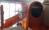 Unique to the Symphony is the 1,350-square-foot Ultimate Family Suite, which will probably get the most attention for the slide that connects an upper level kid's sleeping area to the main floor. The room goes for $50,000 a week in the Med for a family of four and is reportedly sold out through 2018.